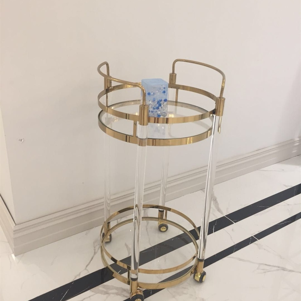 Round gold metal and clear acrylic service trolley