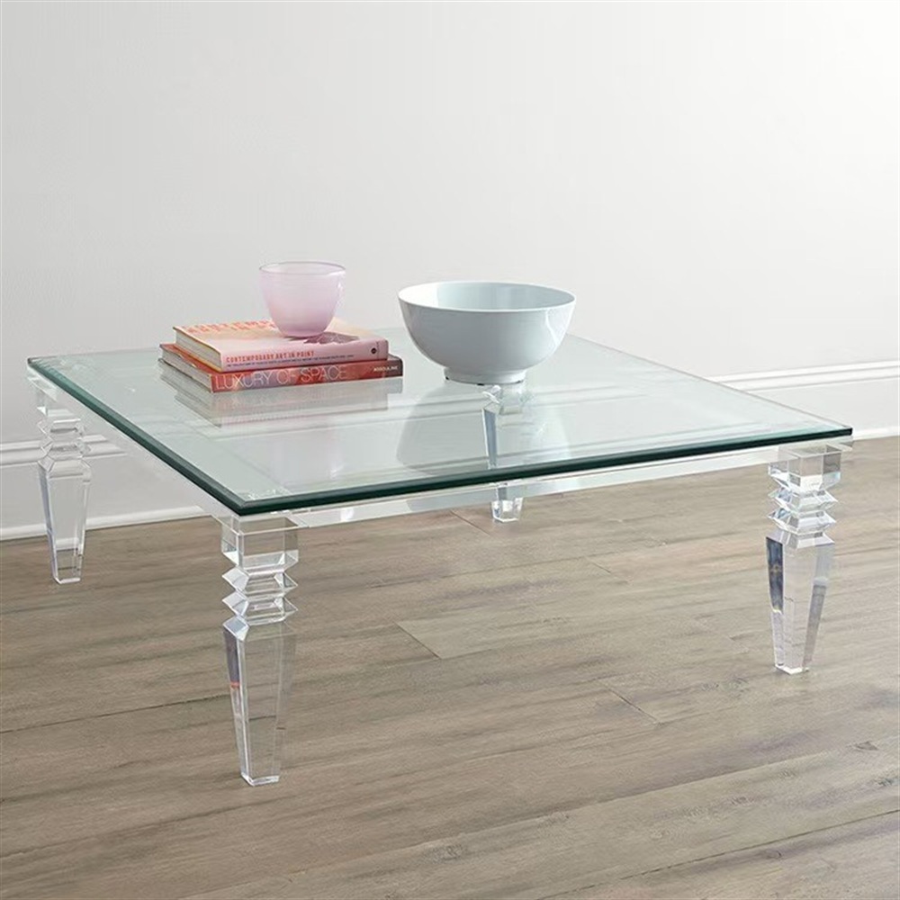 Square glass coffee table with carved clear acrylic pillar legs