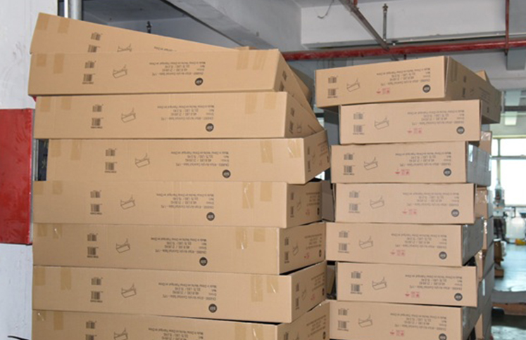 Stacked-acrylic-stool-shipping-cartons-in-factory-warehouse