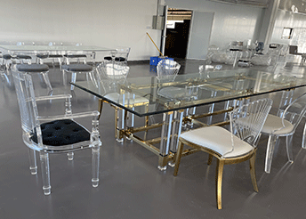Transparent acrylic dining table with modern chairs
