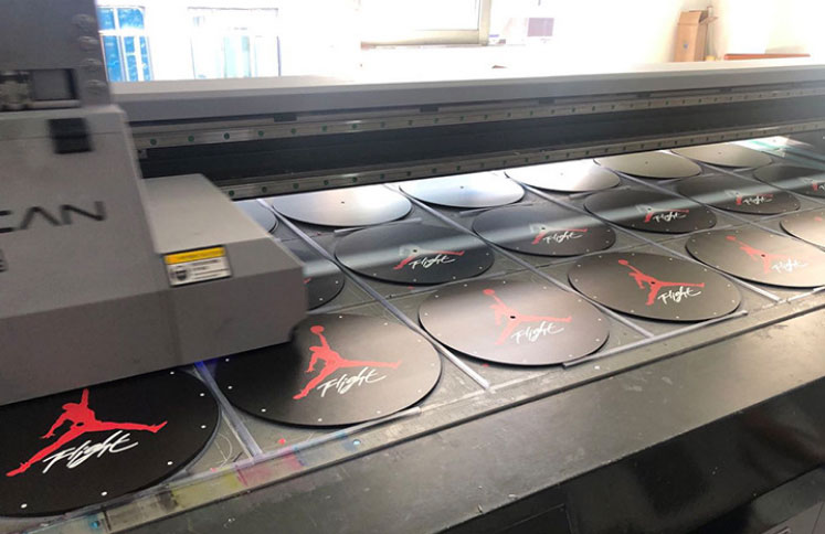 UV printer producing custom round acrylic panels
