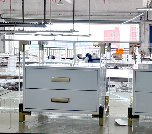 White acrylic two-drawer nightstand with gold handles
