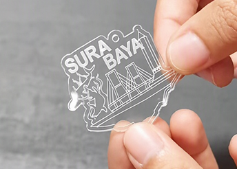 custom-clear-acrylic-keychain-with-architectural-artwork-botanical-illustration-and-sura-baya-lettering