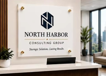 custom clear acrylic reception sign displaying the north harbor consulting group logo and branding