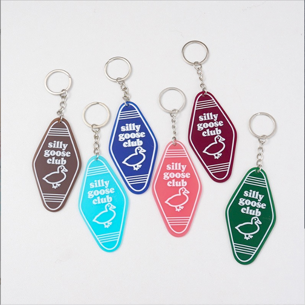 custom-colorful-acrylic-key-tags-with-silly-goose-club-lettering-and-goose-graphics