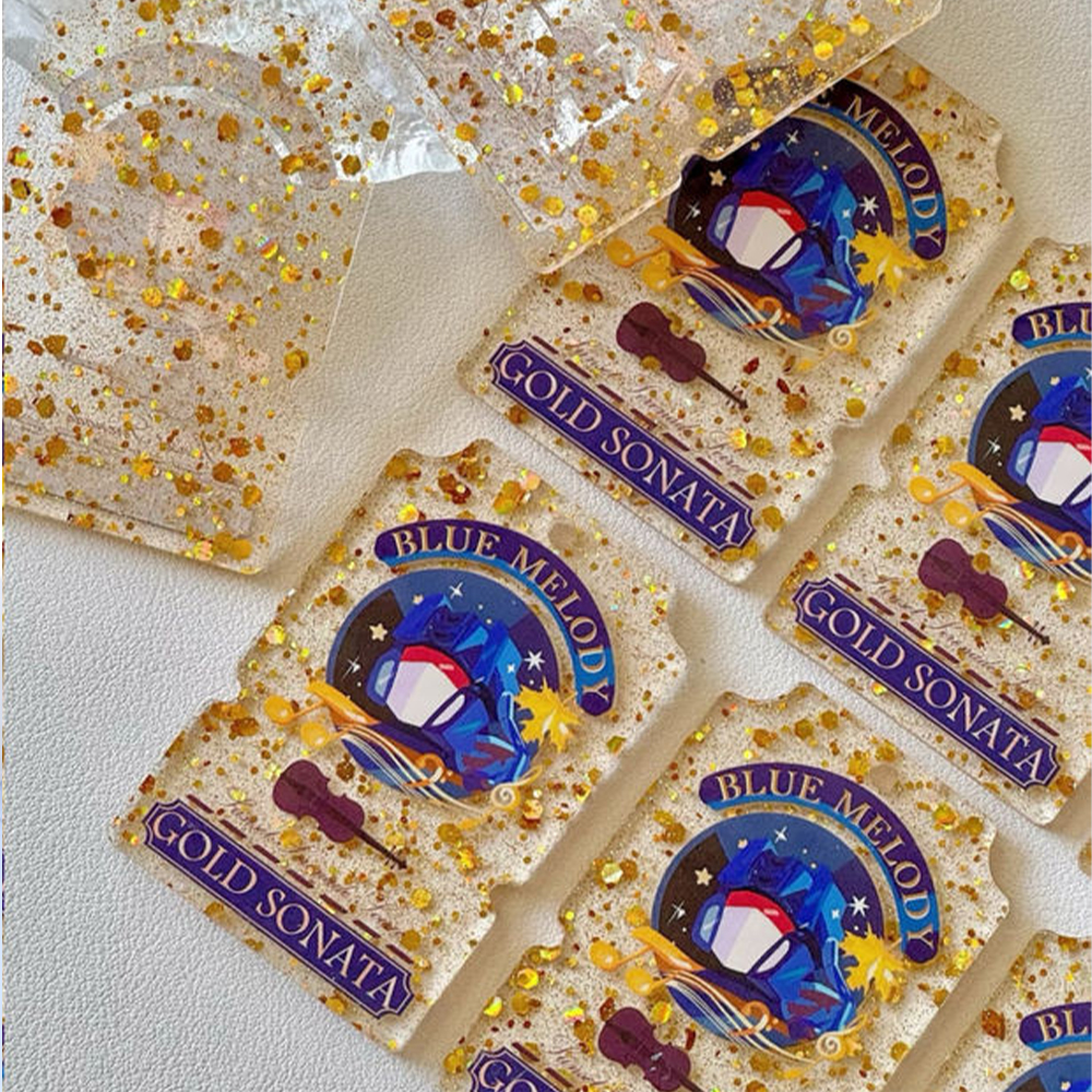 custom-double-sided-glitter-acrylic-keychains-with-colorful-music-themed-artwork