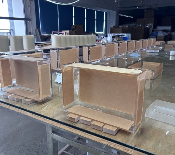 factory-acrylic-display-box-batch-assembly-kraft-liner-protective-film-workshop