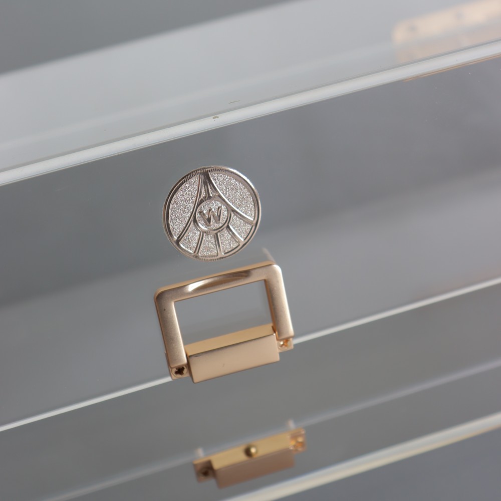 gold-handle-detail-on-clear-acrylic-drawer