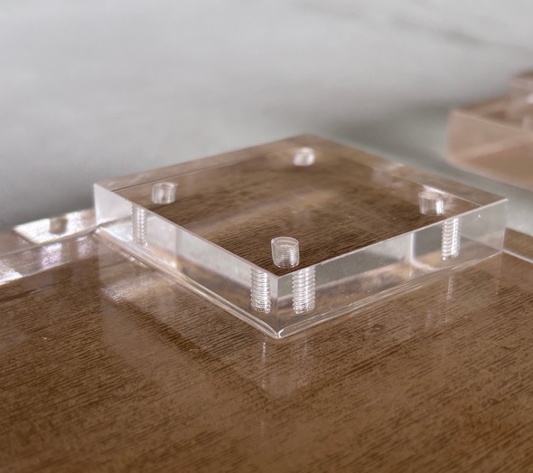 cnc-threaded-screw-holes-acrylic-mounting-block