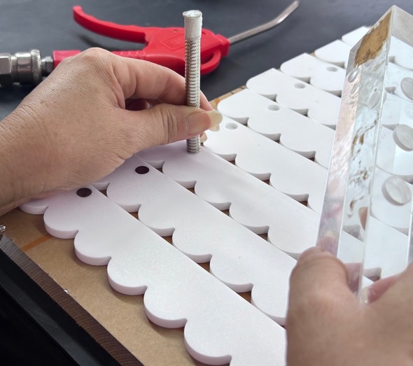 inserting-neodymium-magnets-white-scalloped-acrylic-racks