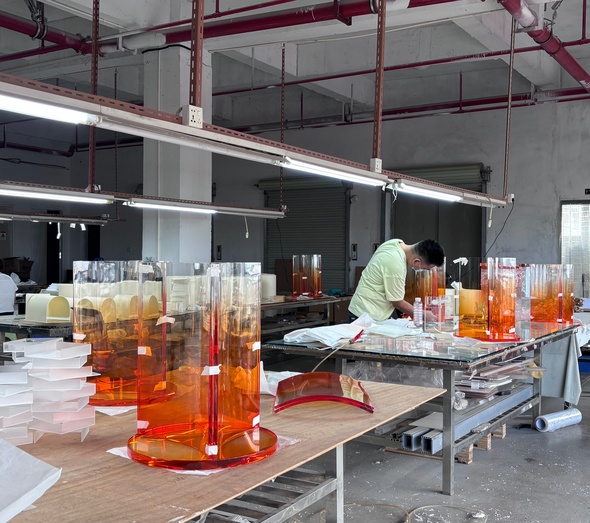 orange-acrylic-pedestal-bases-assembly-line-workshop
